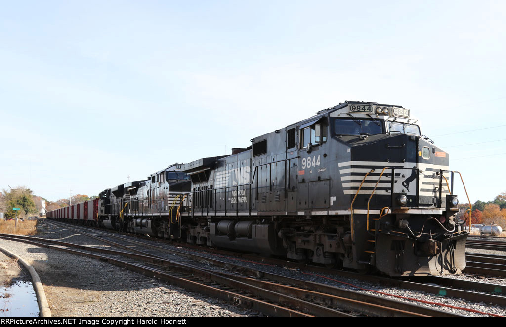 NS 9844 is on the point of a Herzog balast train in Glenwood Yard